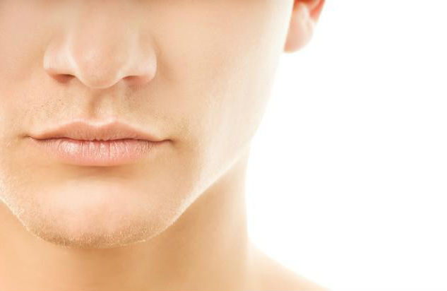 parte do rosto de um homem mostrando a boca e nariz.